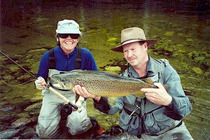 Lindsay with a happy client and her catch