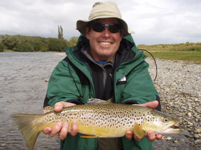 Happy angler with a Mataura Brown Trout